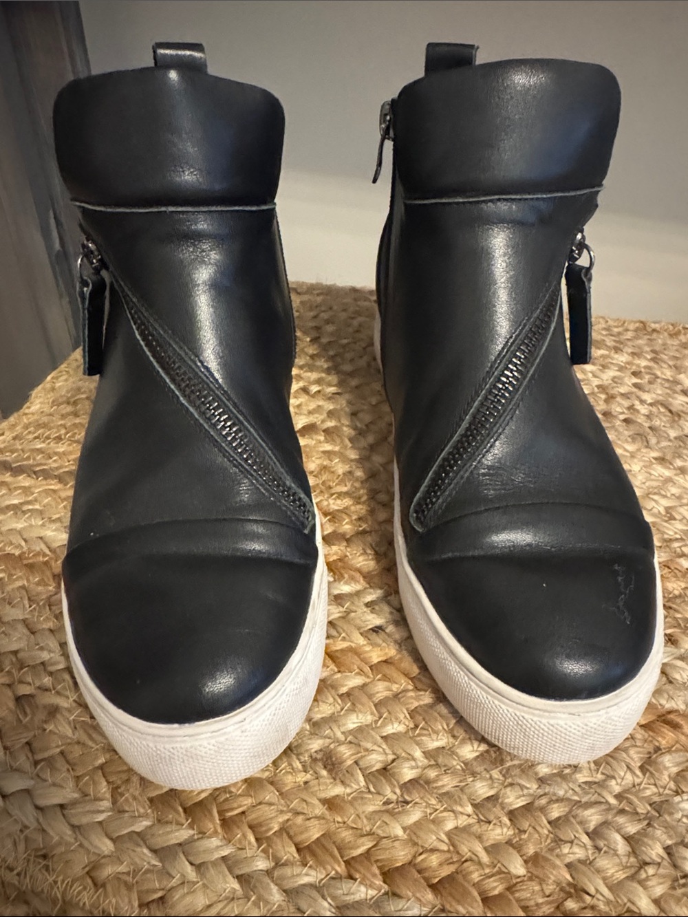 All Black leather high tops with zip closures.